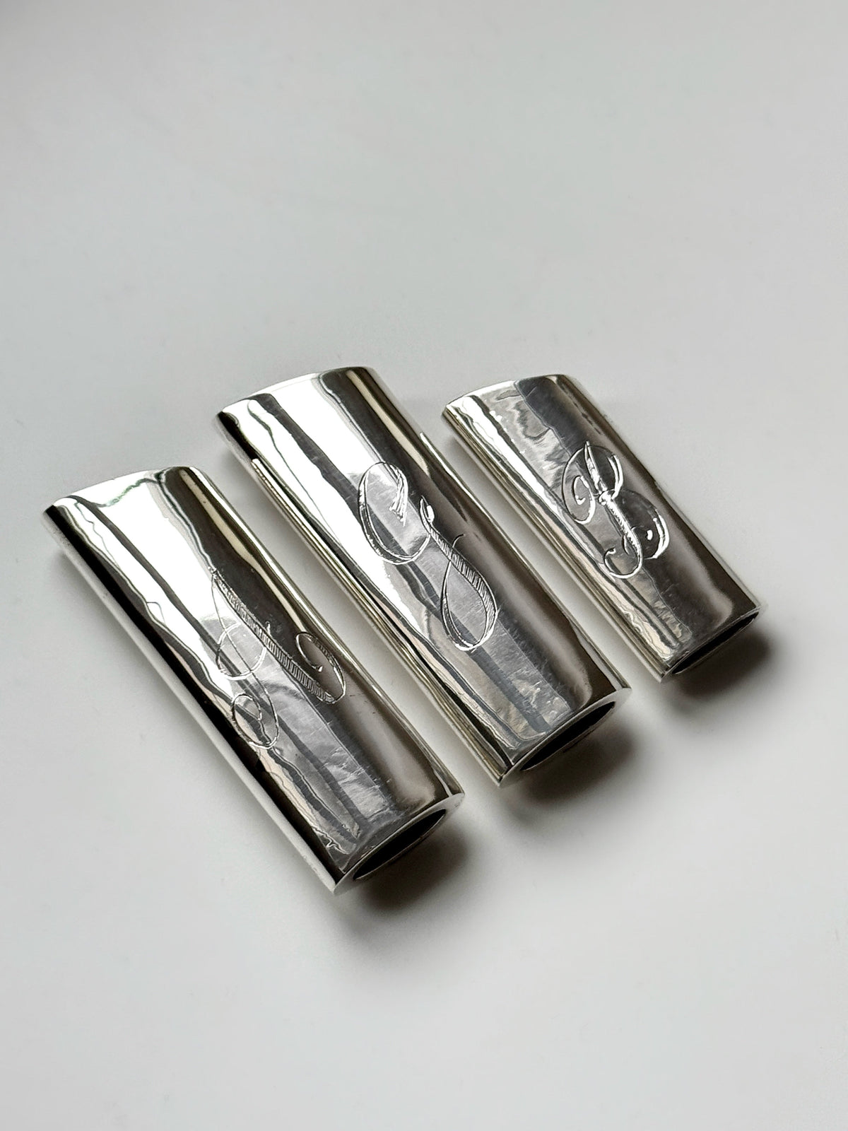 Monogram Lighter Case Maxi Size — close-up of polished silver surface