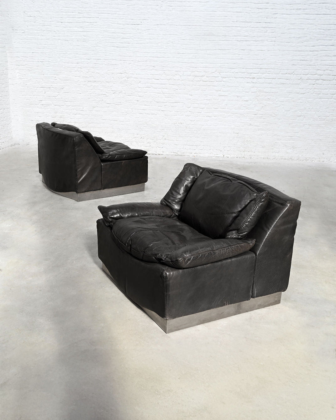 Pair of black leather Frigerio armchairs on metal base, 1960s