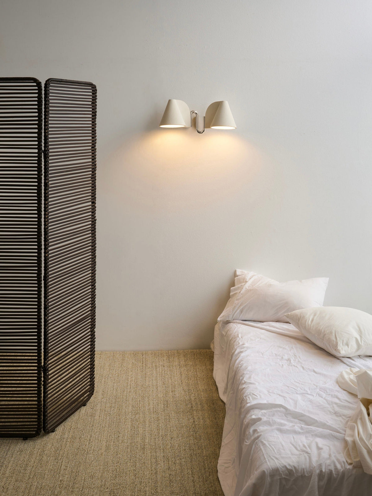 Synapse Wall Light — side view in minimalist bedroom setting