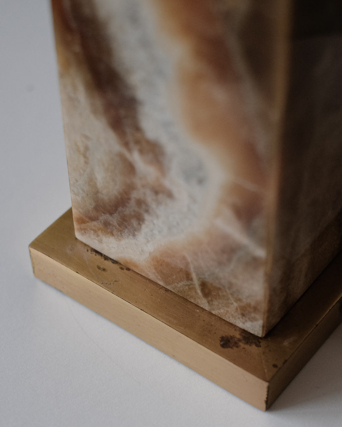 Onyx Table Lamp — close-up of onyx base with brass accent