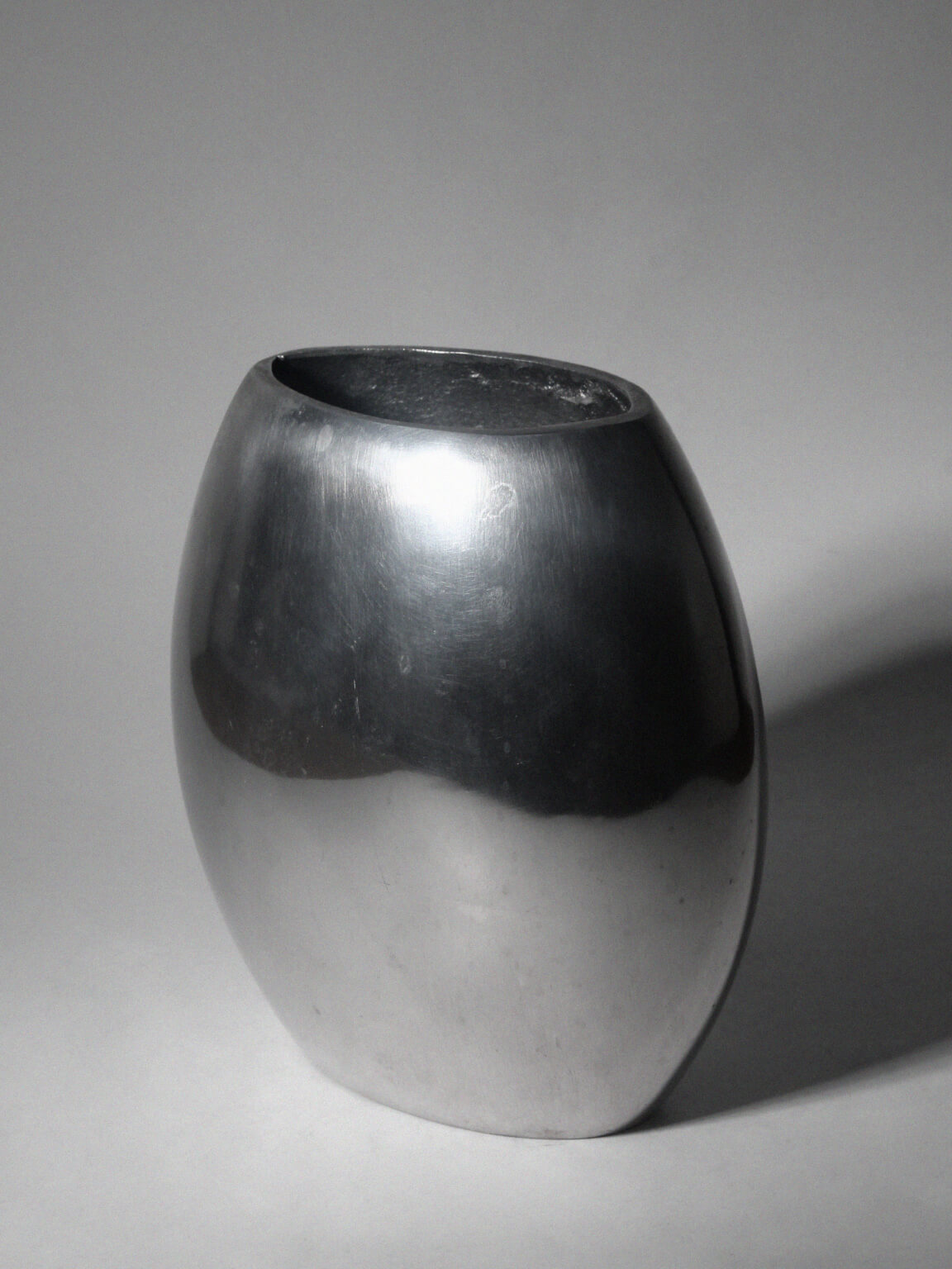 Polished Aluminum Flat Rounded Vase — detail view