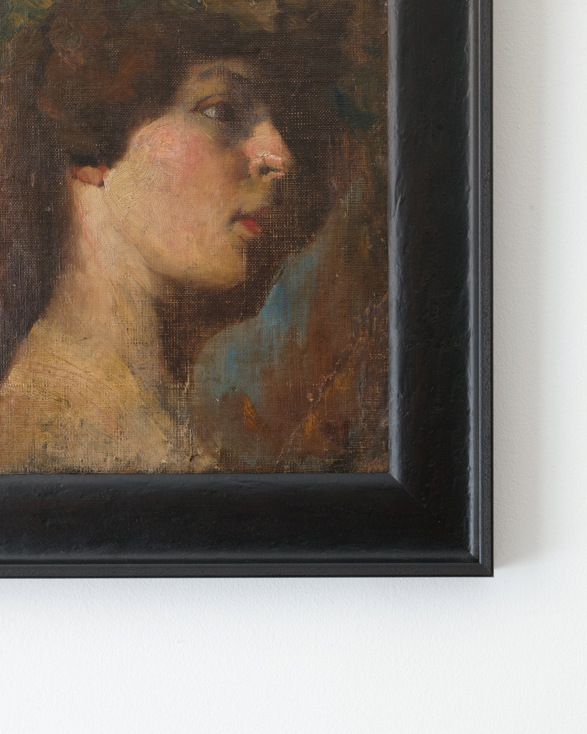 Victorian portrait painting showing woman in profile with curly hair
