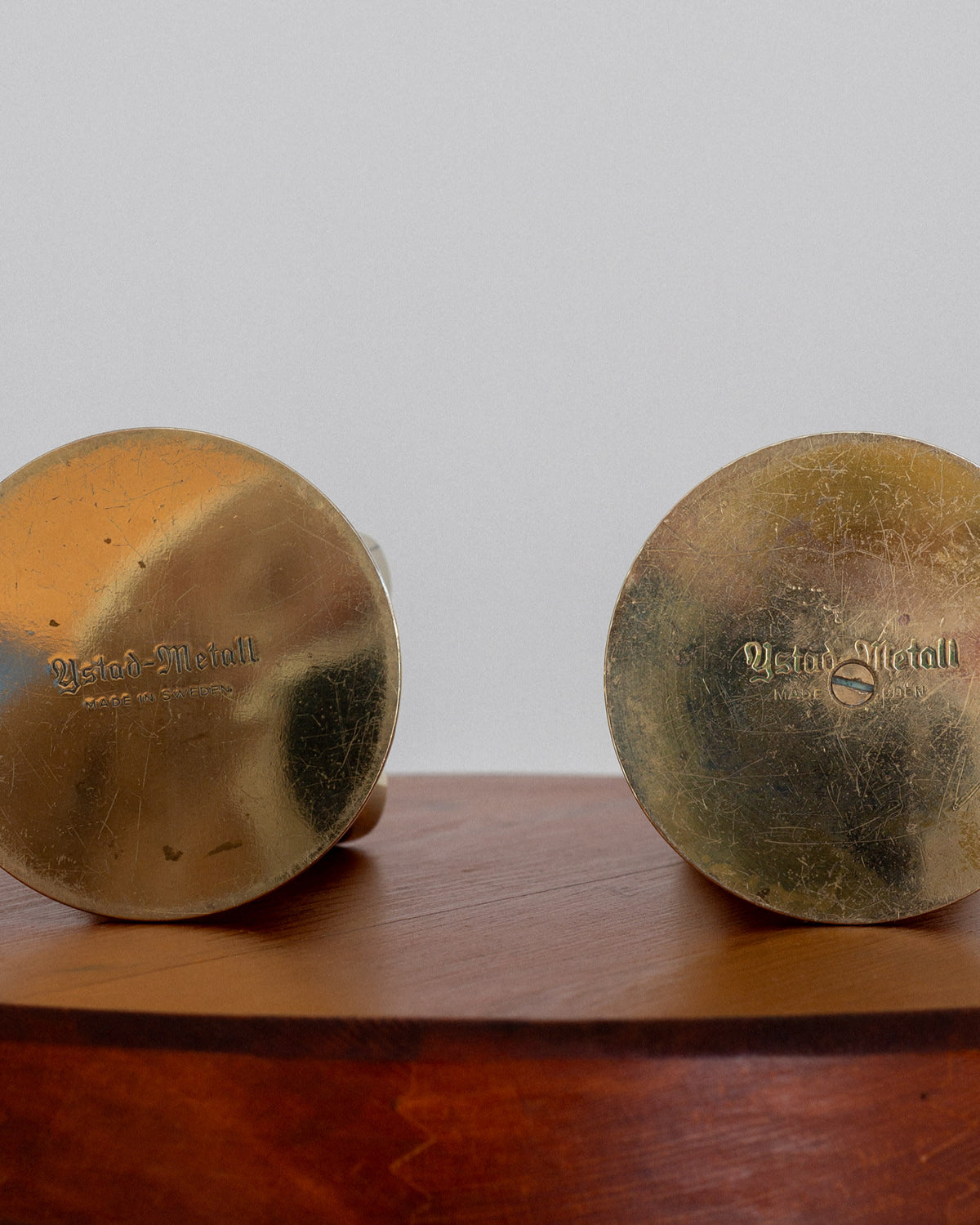 Bottom view detail of Scandinavian brass vases showing maker marks