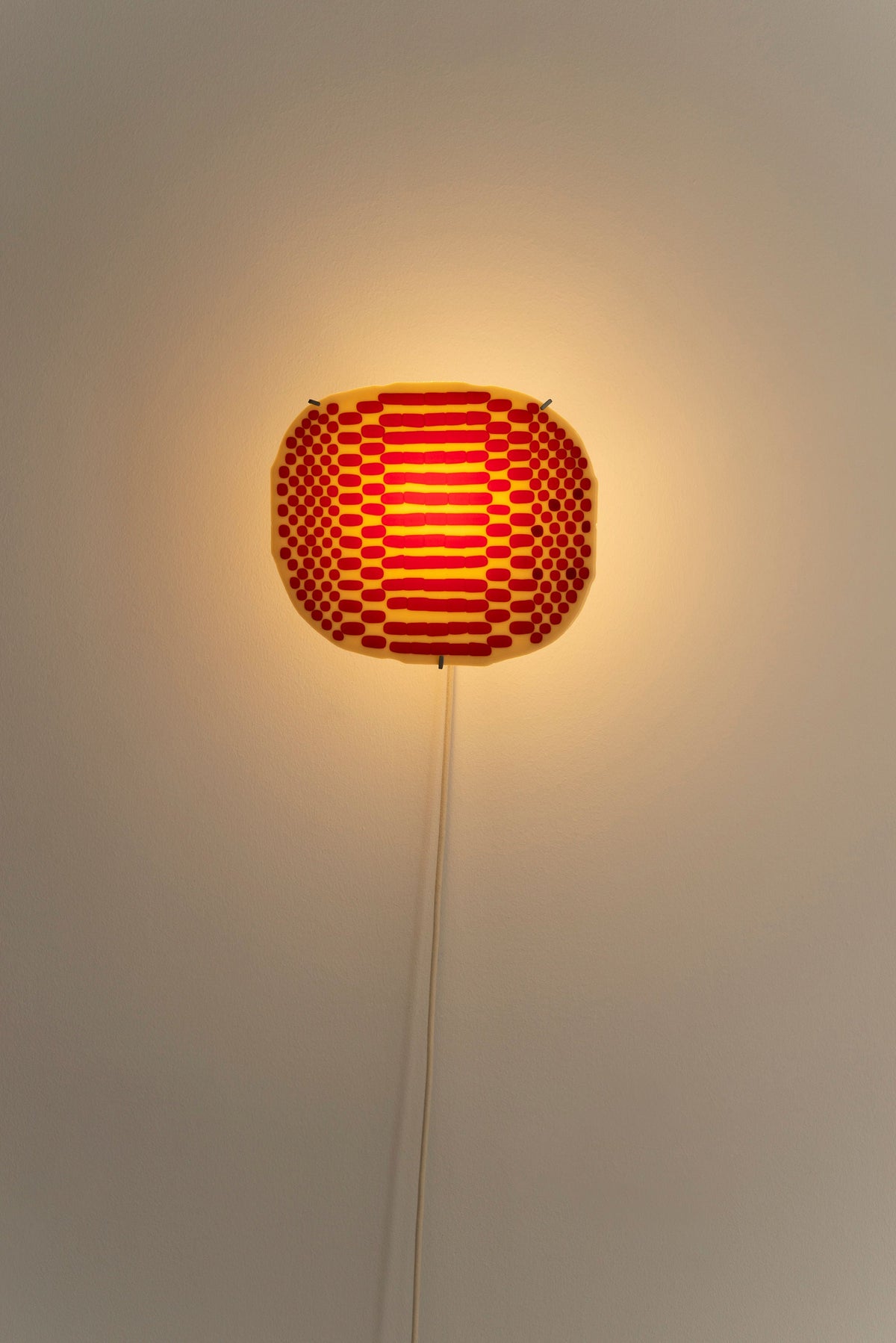Illuminated red dot pattern detail of Beige Checker Wall Lamp