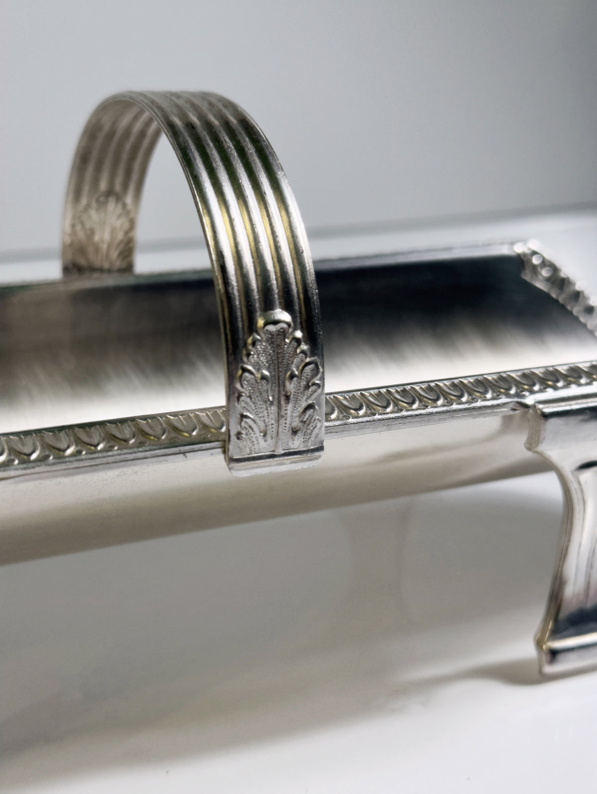Silver-plated grissini holder with ribbed handle and ornate decorative details