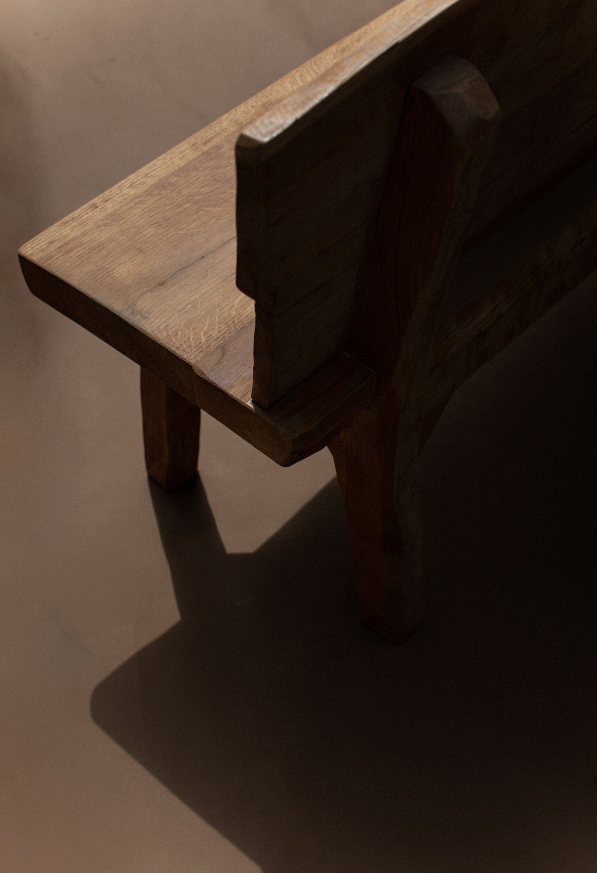 Brutalist bench corner detail showing geometric wood construction