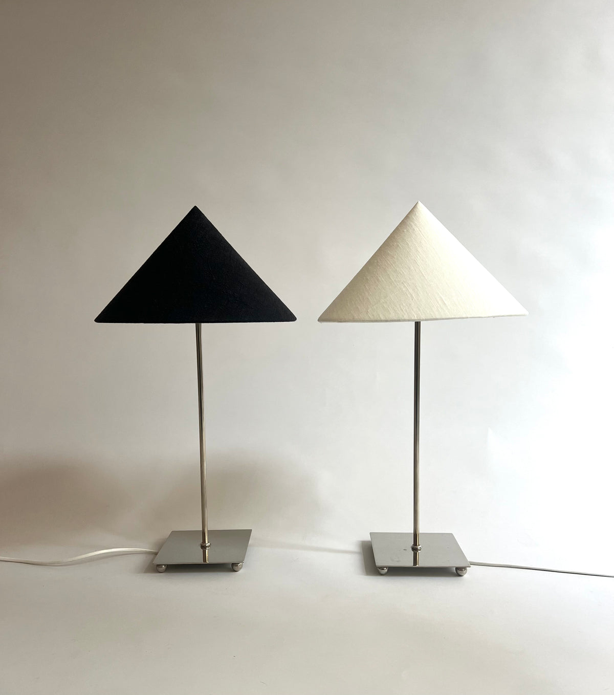 Levento' Table Lamp — close-up of black and white fabric shades