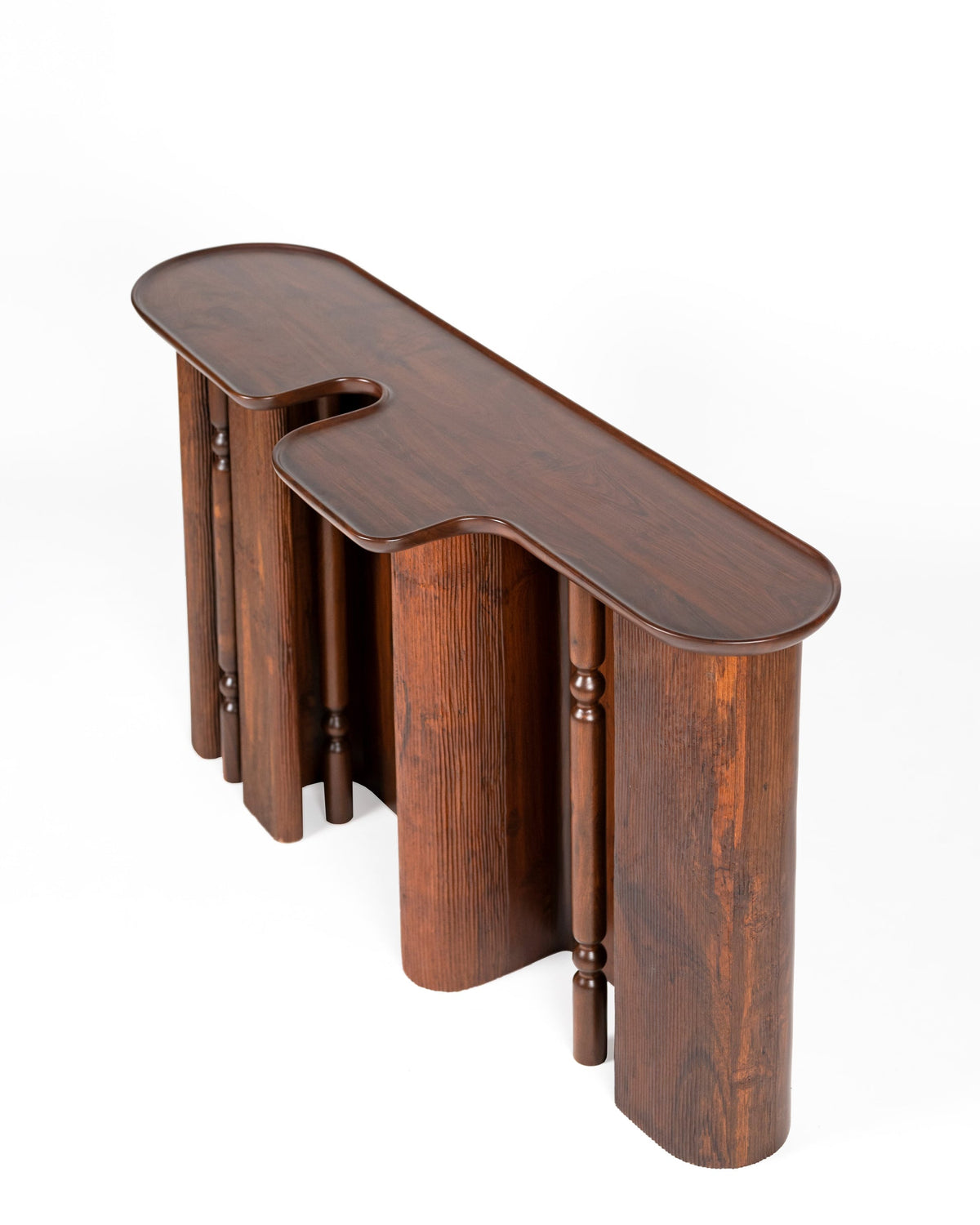 Ridge Console Table — top view of dark wood with curved edges