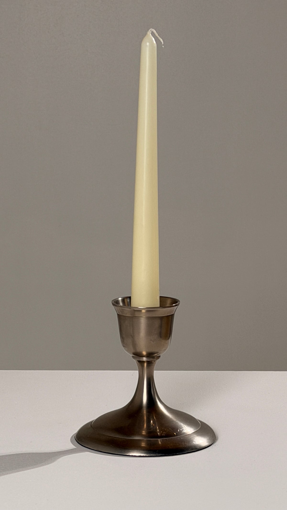 Silver-plated Metal Candleholders, France, circa 1930 — side angle with cream candle