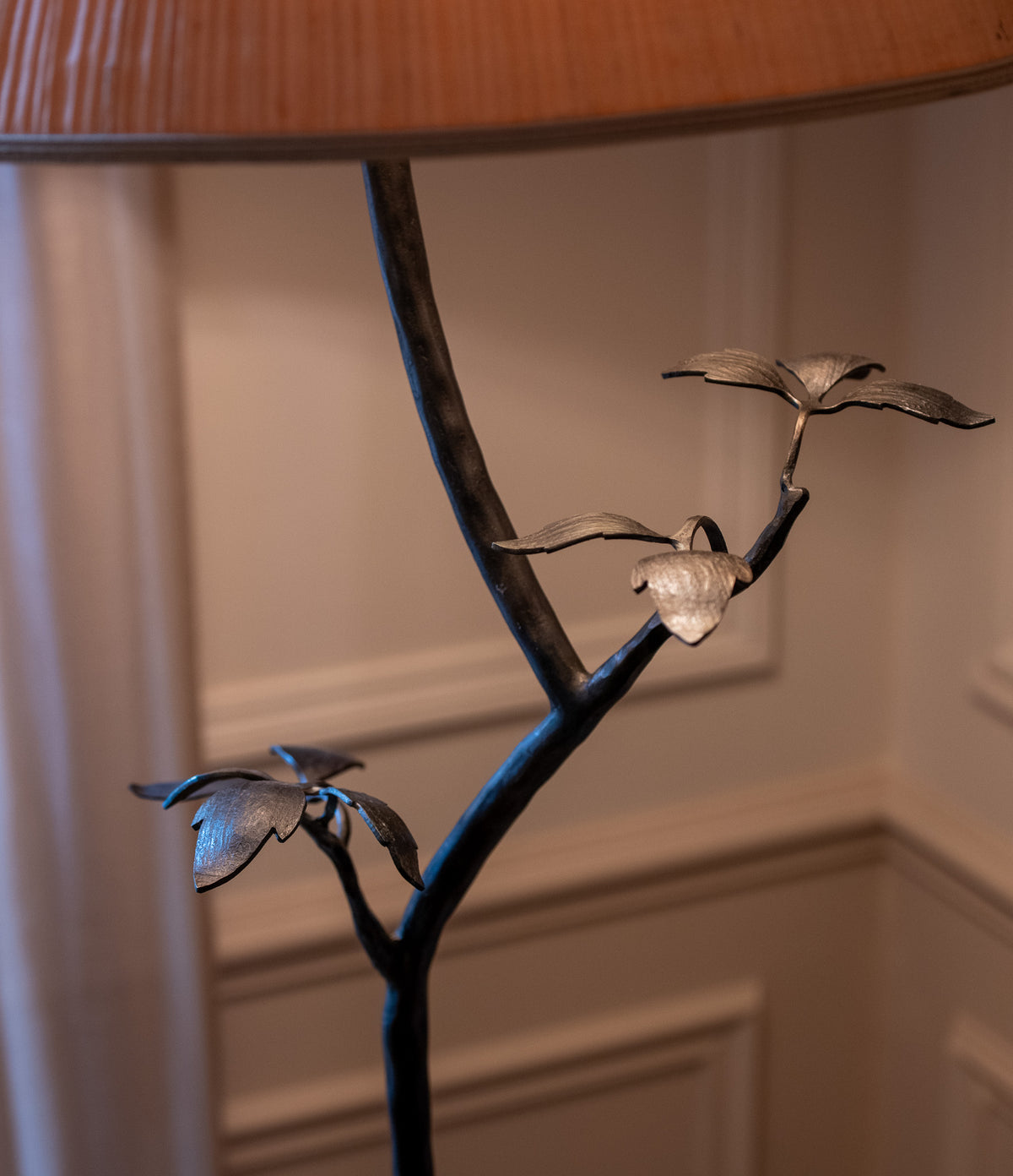 Clematis floor lamp detail showing sculptural metal branch with leaves