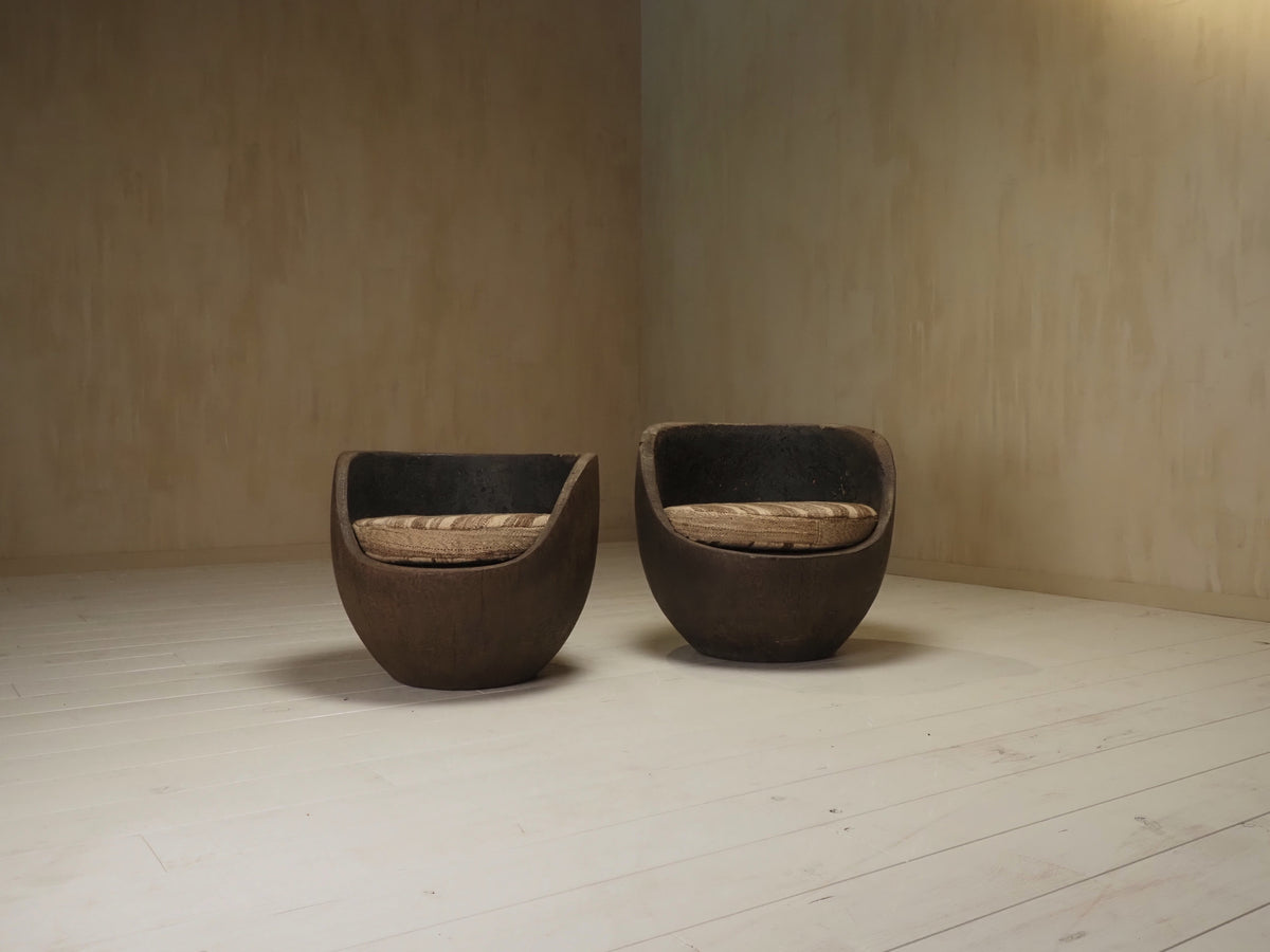 Sculptural mid-century hand-carved pair lounge chairs — side angle