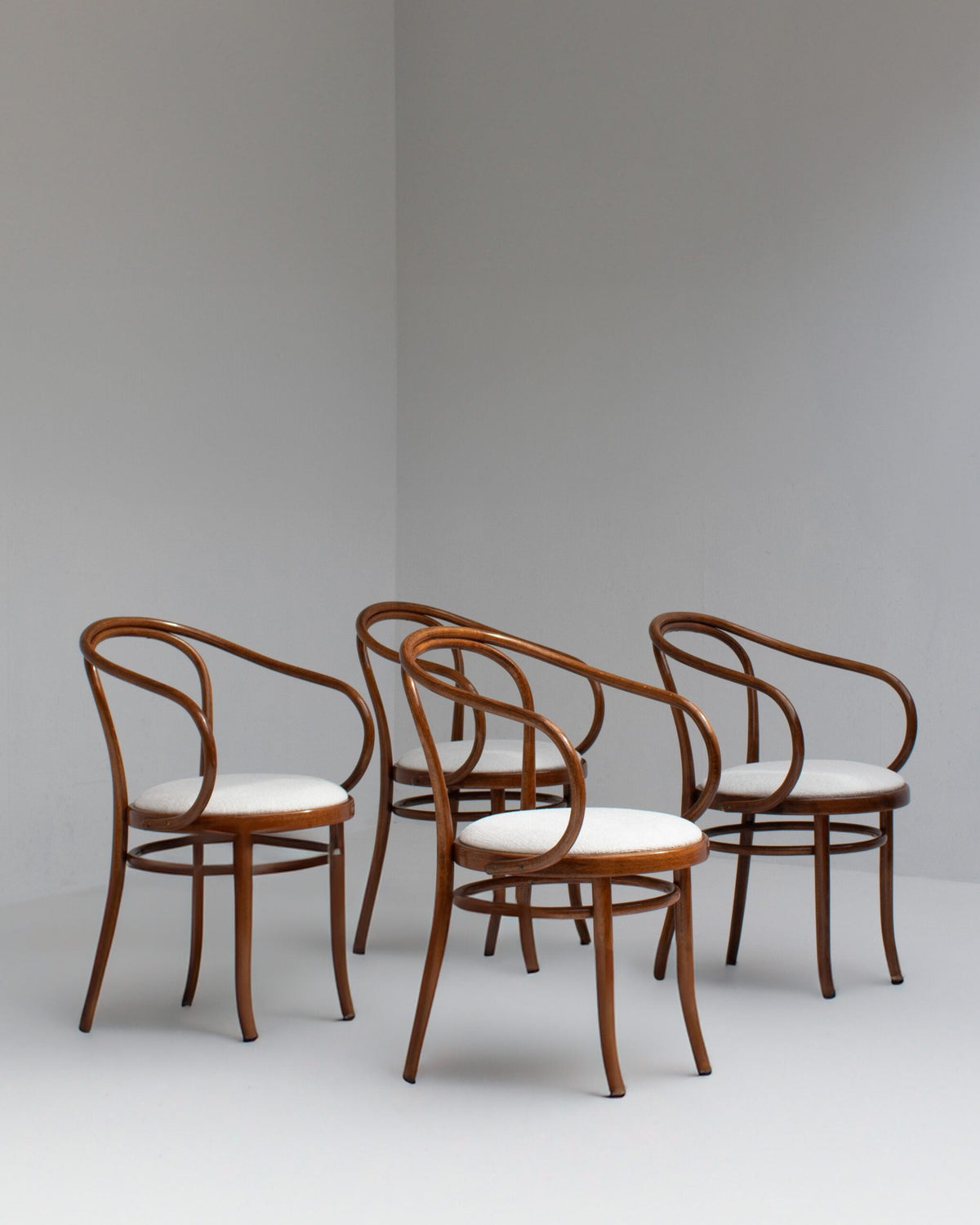 Set of Four Thonet Bentwood Armchairs in Walnut with Bouclé Upholstery — side angle