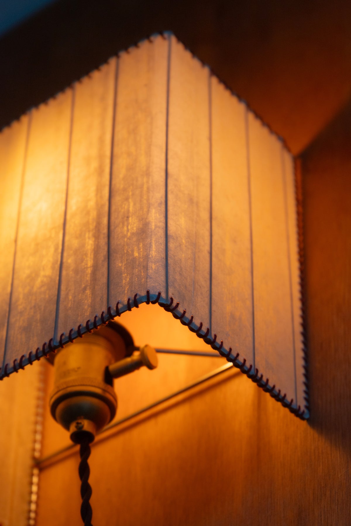Magdalena Sconce — side angle showing warm light and fabric shade