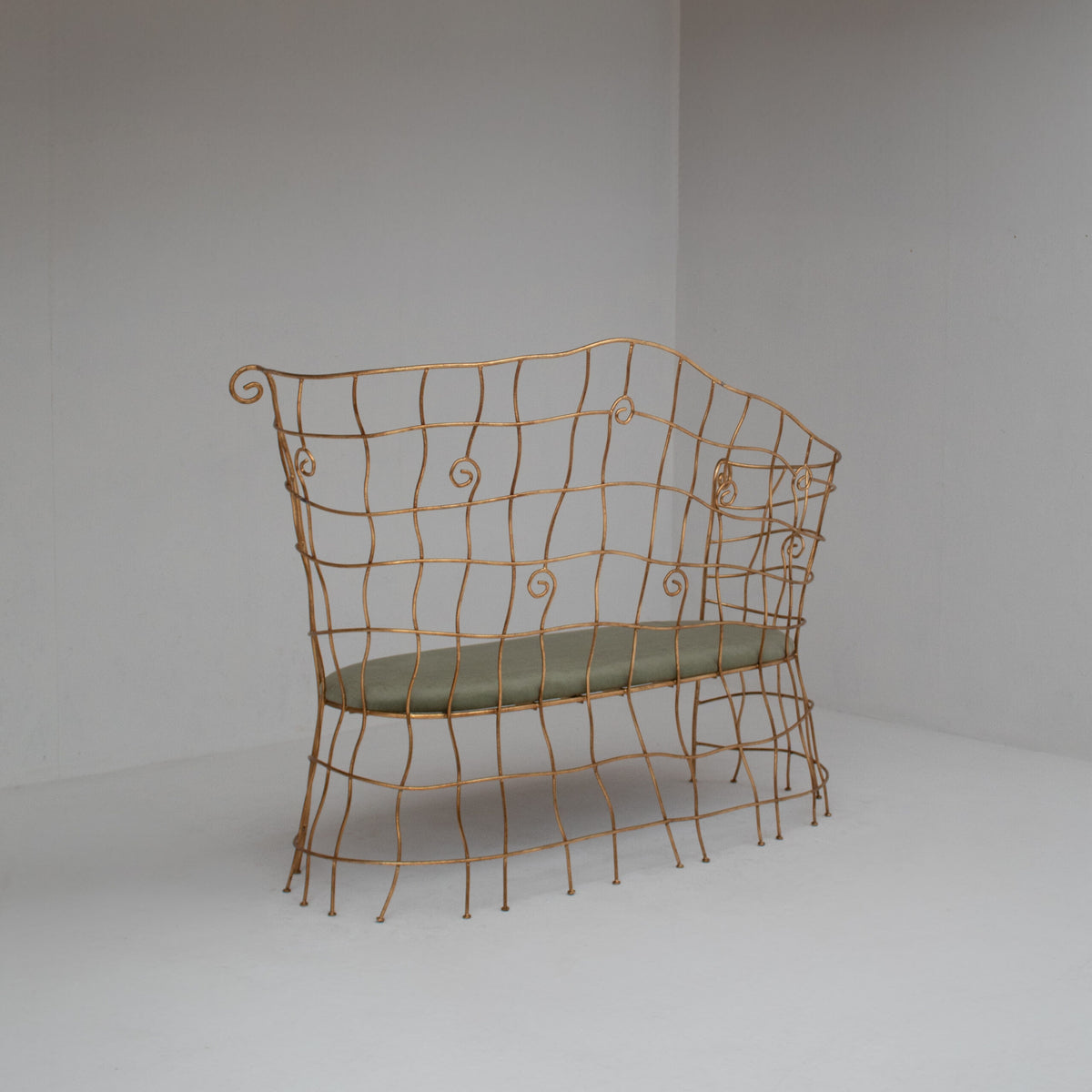 Sculptural Gilt Metal Bench with Green Upholstery — detail view