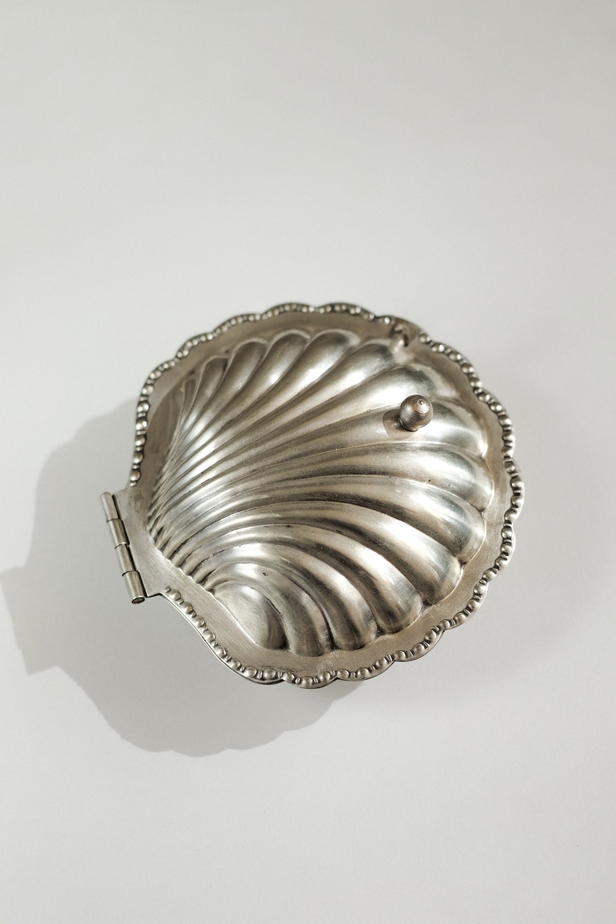 Shell Shaped Butter Dish — top view of silver dish with hinge