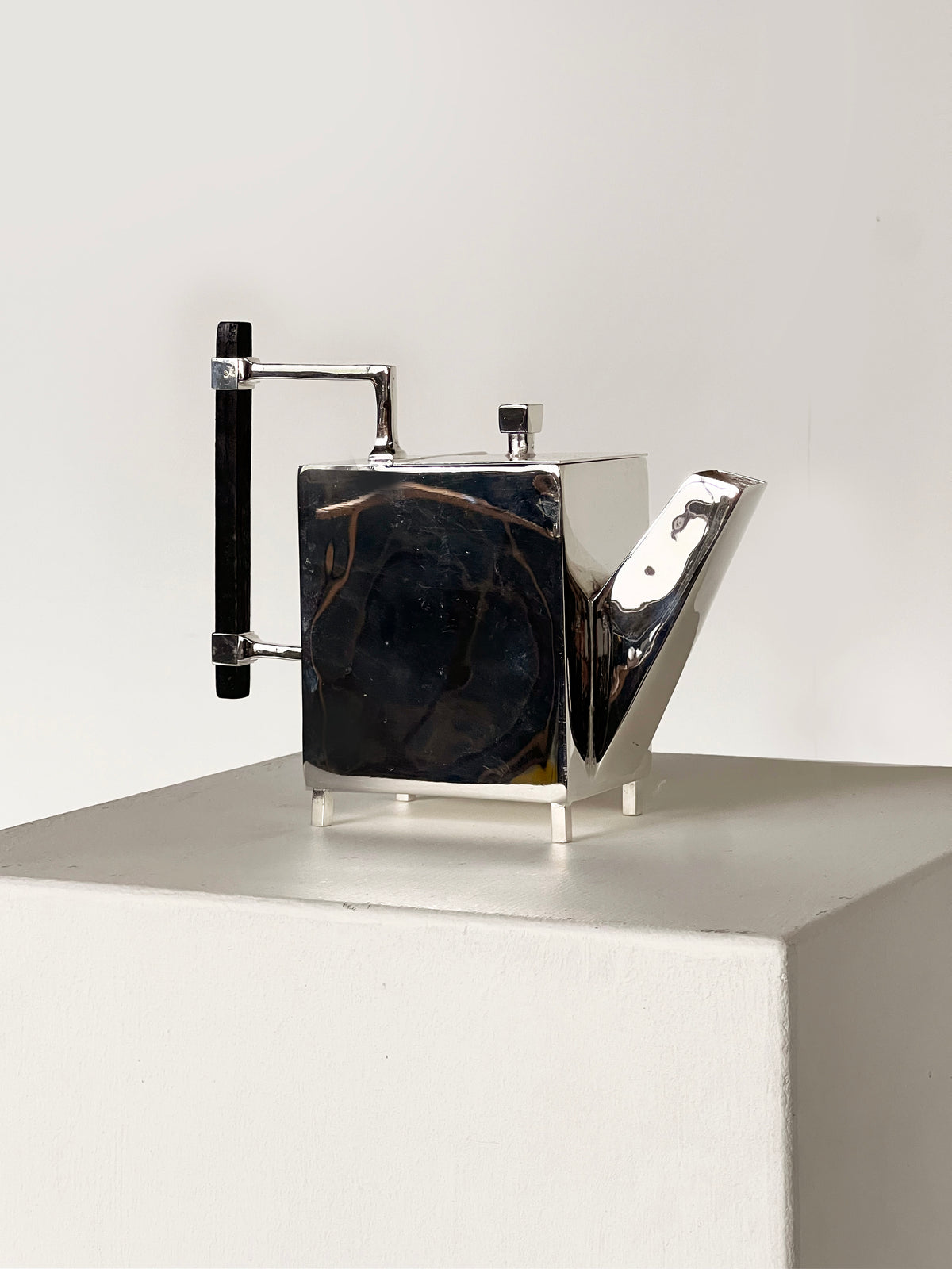 Christopher Dresser Square Ornate Teapot — side angle showing polished metal surface