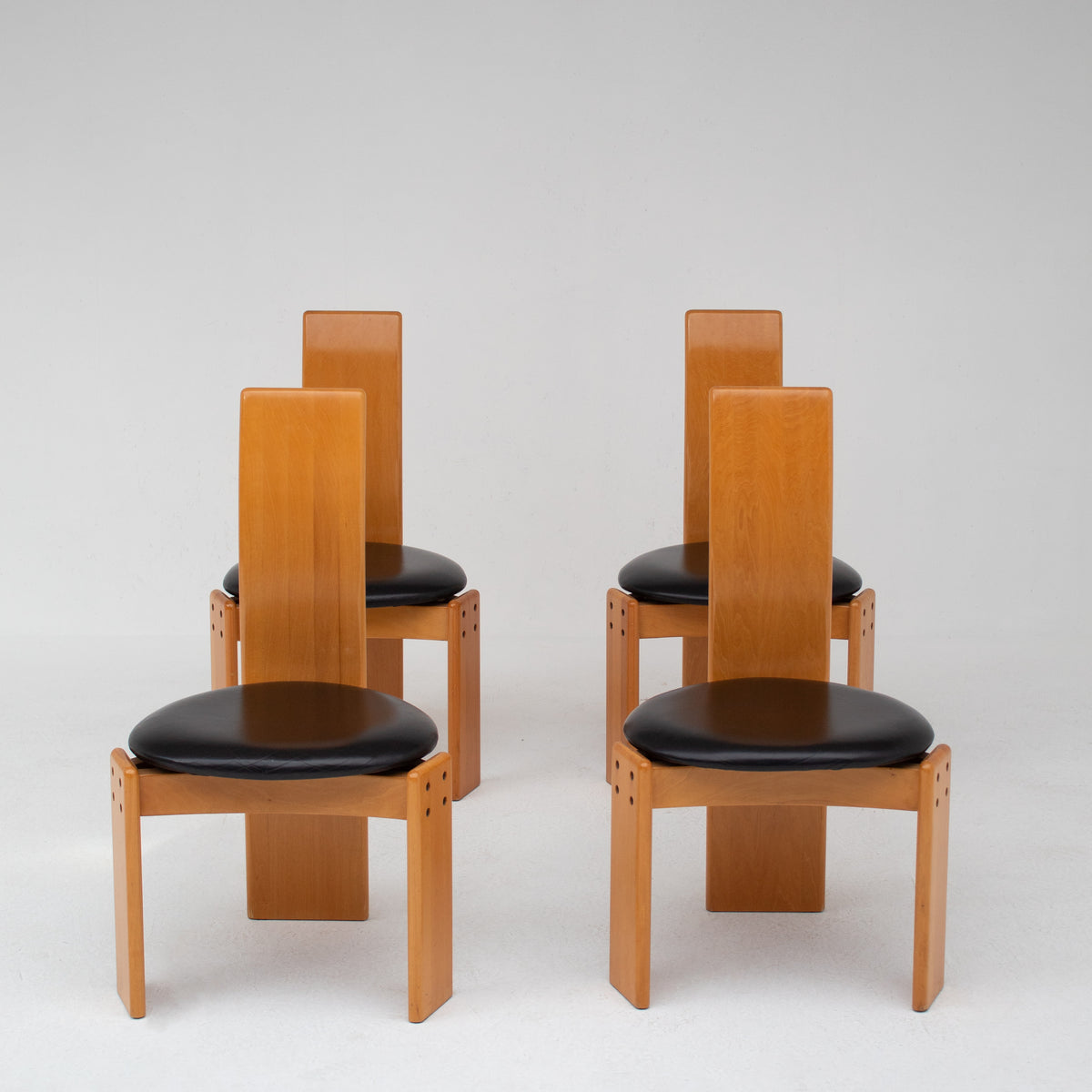 Set of Dining Chairs in Wood and Leather by Mario Marenco for Mobil Girgi — front view of four chairs with wooden backs and l