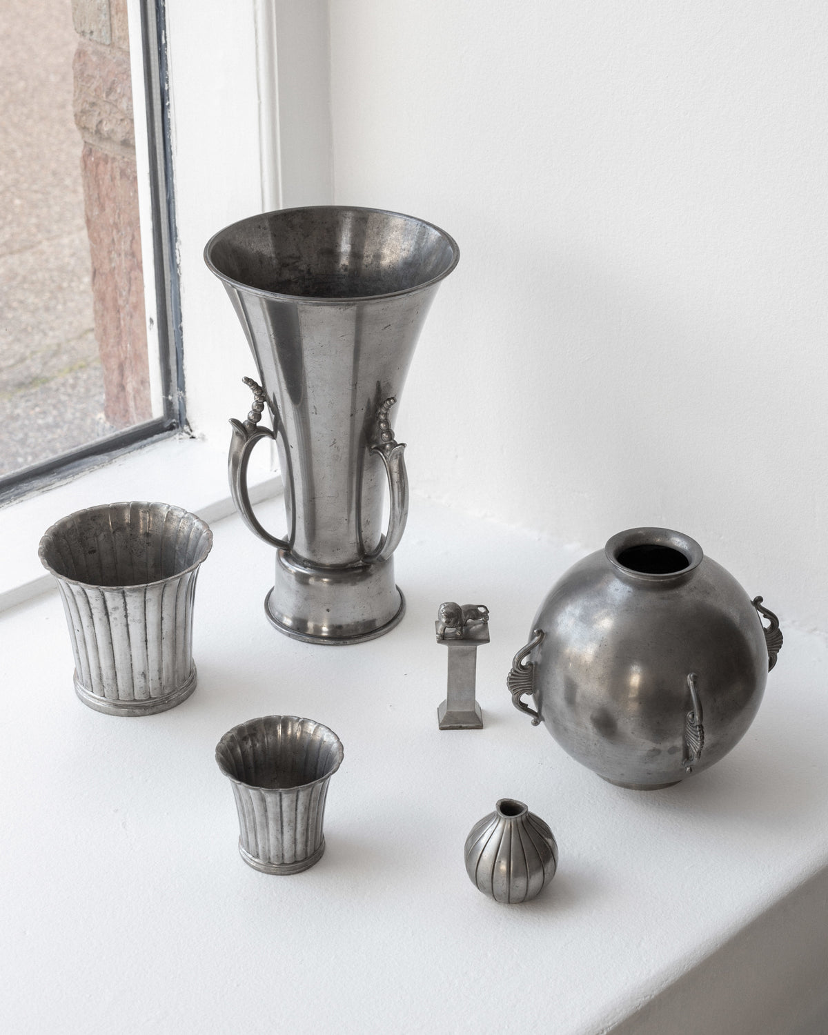 Art Deco pewter vase collection display by Ystad Metall