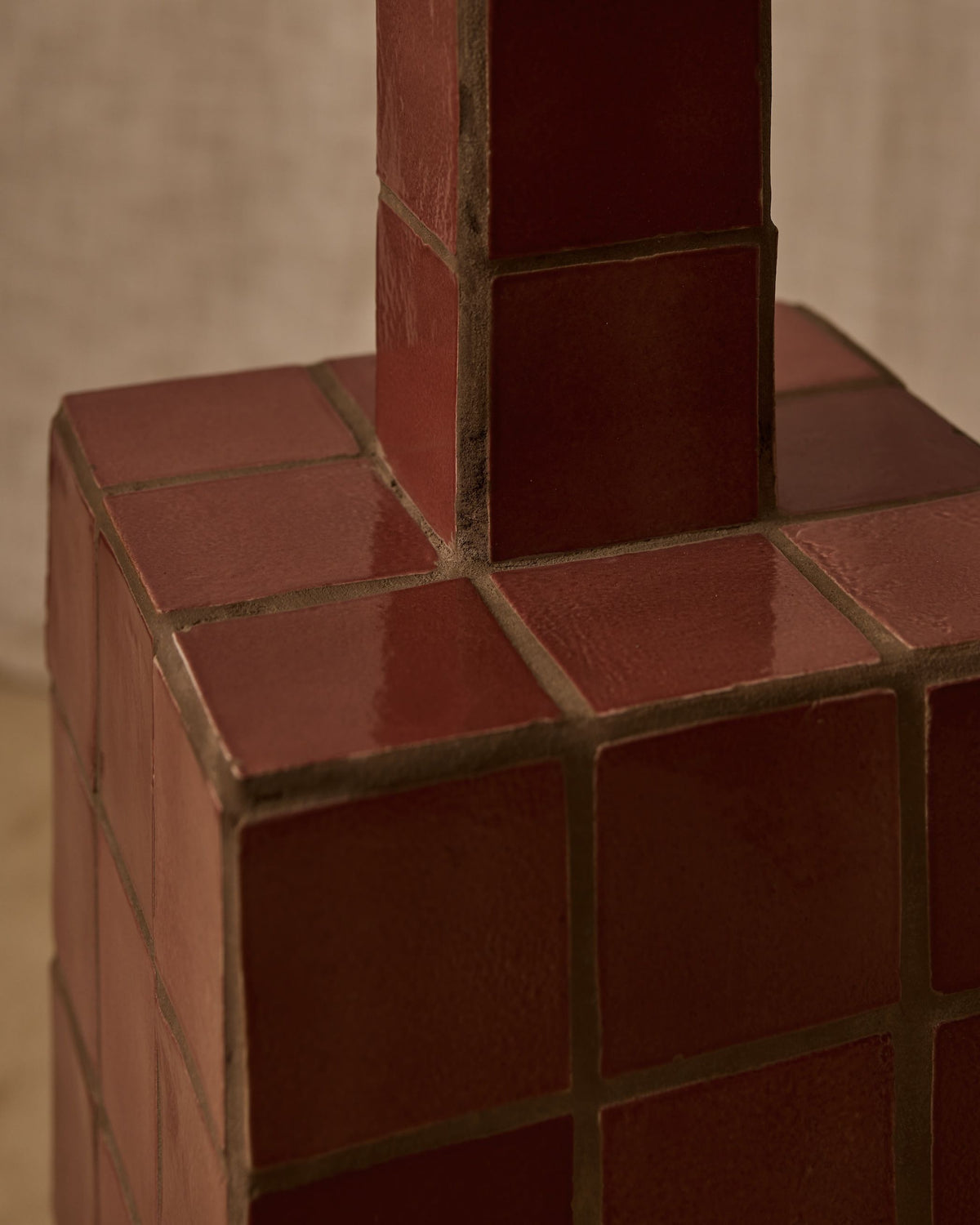 Jura floor lamp base detail showing textured terracotta blocks