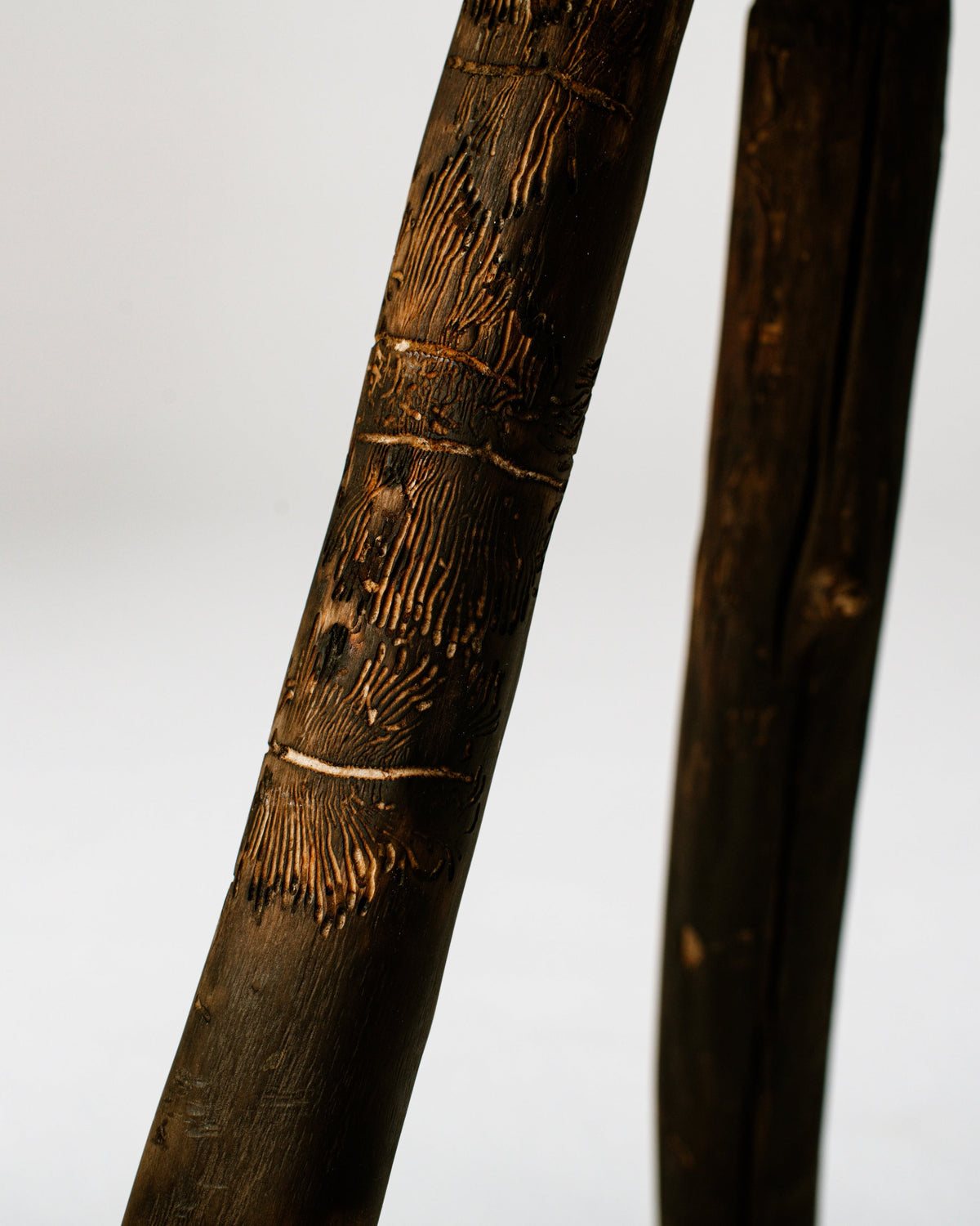 Detailed view of burned bamboo texture on handcrafted stool legs