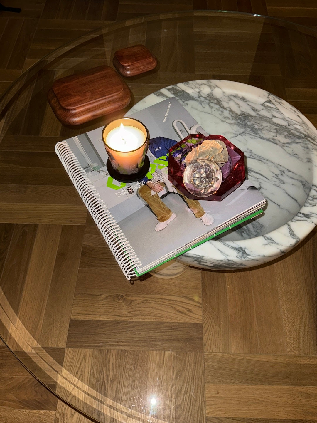 tAAAble Arabescato marble end table styled with candle and notebook