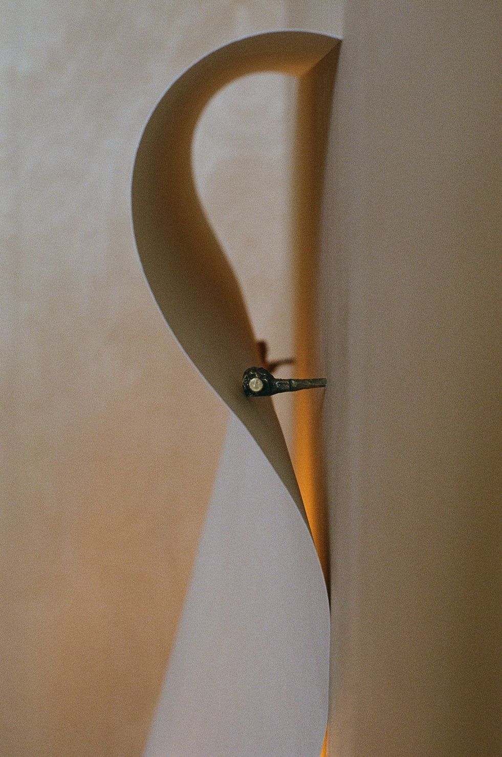 Wall Light - Papēr II — close-up of curved paper design on wall