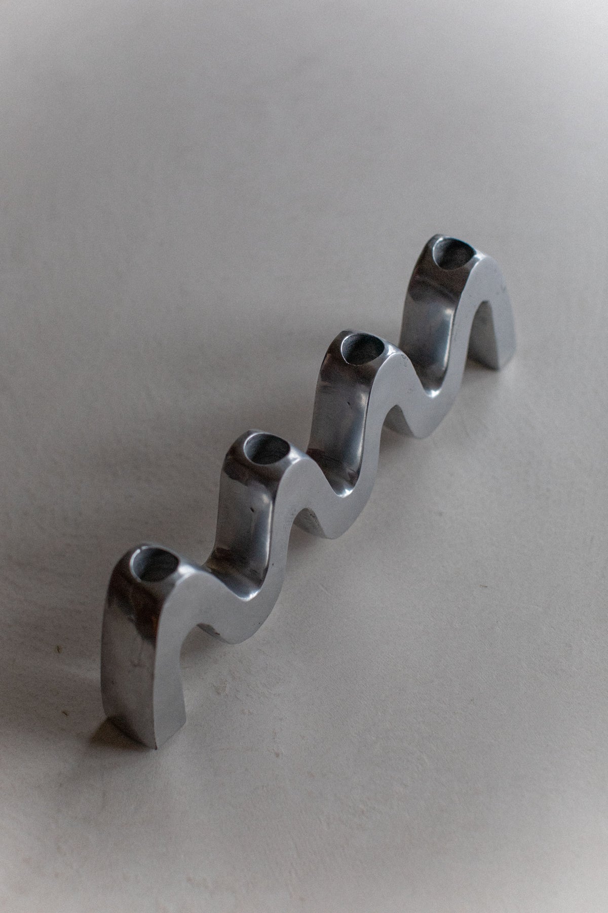  Sleek Steel Candleholder with Wave Pattern for Ambient Lighting
