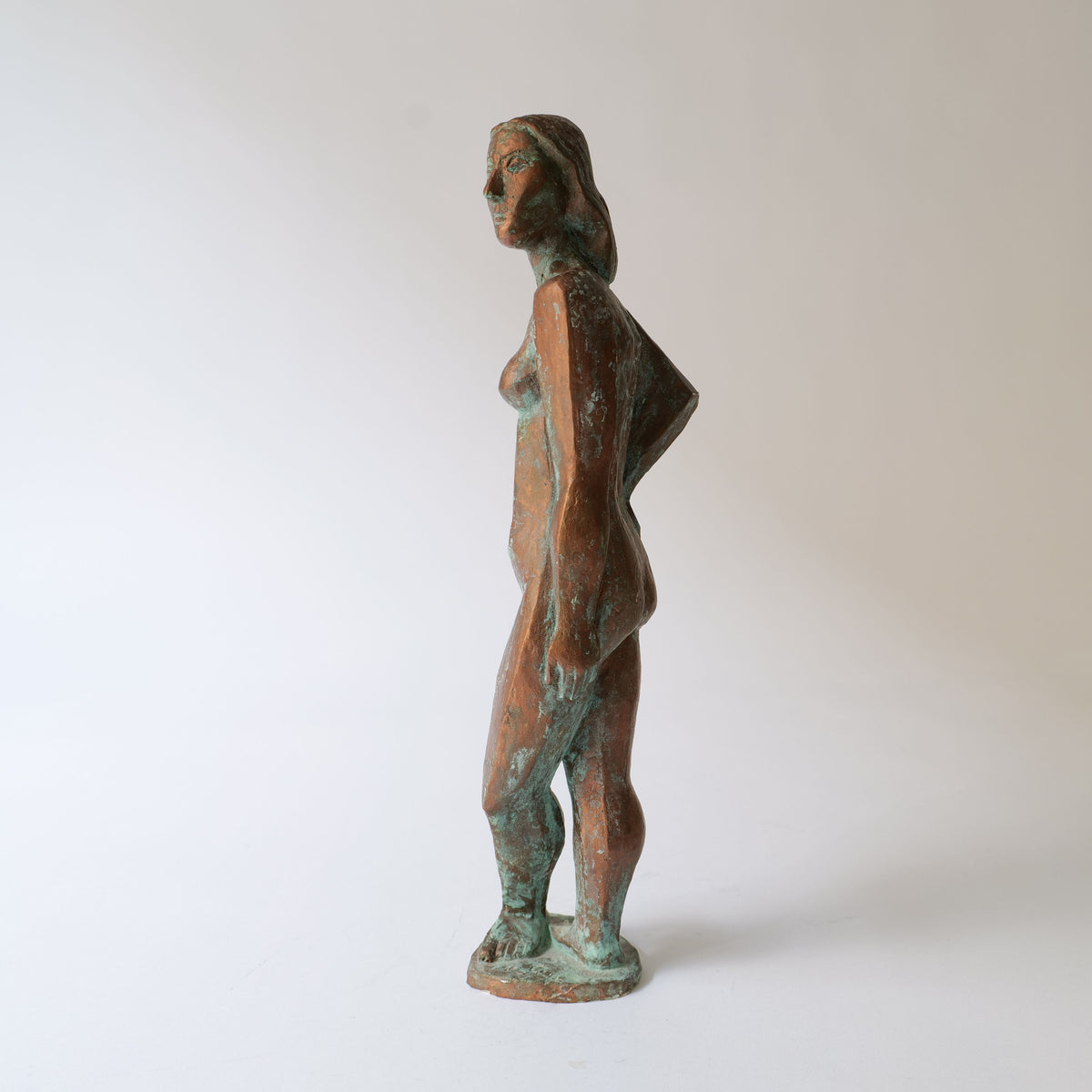  Artistic representation of Roland Alf sculpture in a natural outdoor setting 