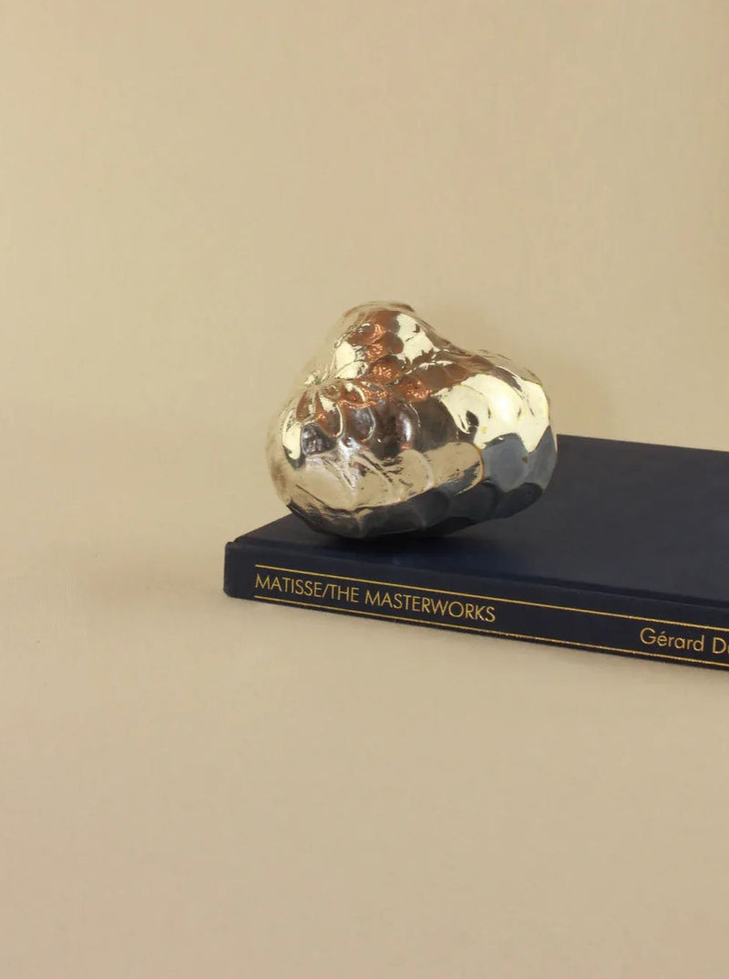 Handcrafted silver custard apple sculpture with intricate detailing and smooth finish