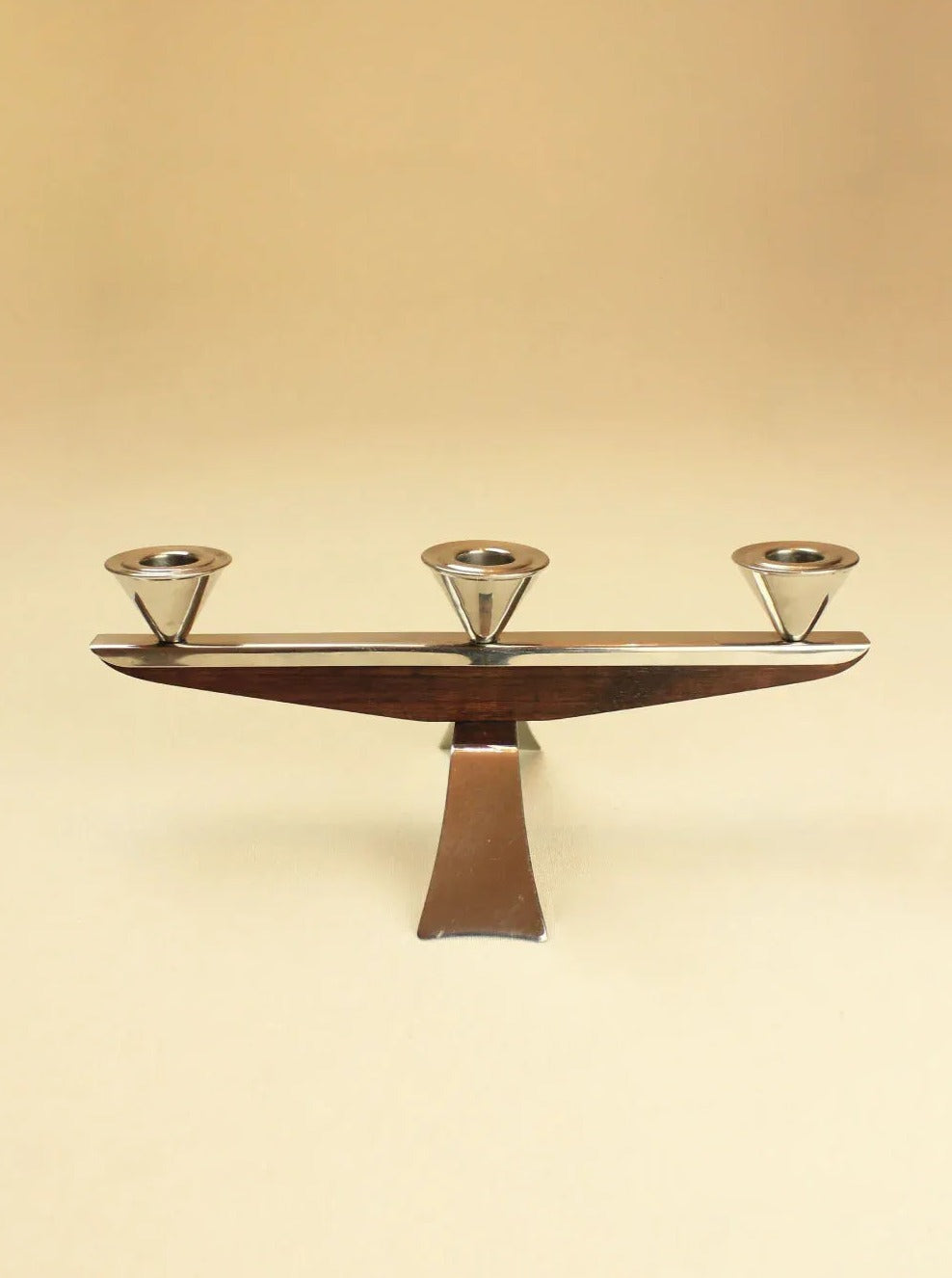 Vintage 1960 Candleholder with a polished gold finish and elegant curves