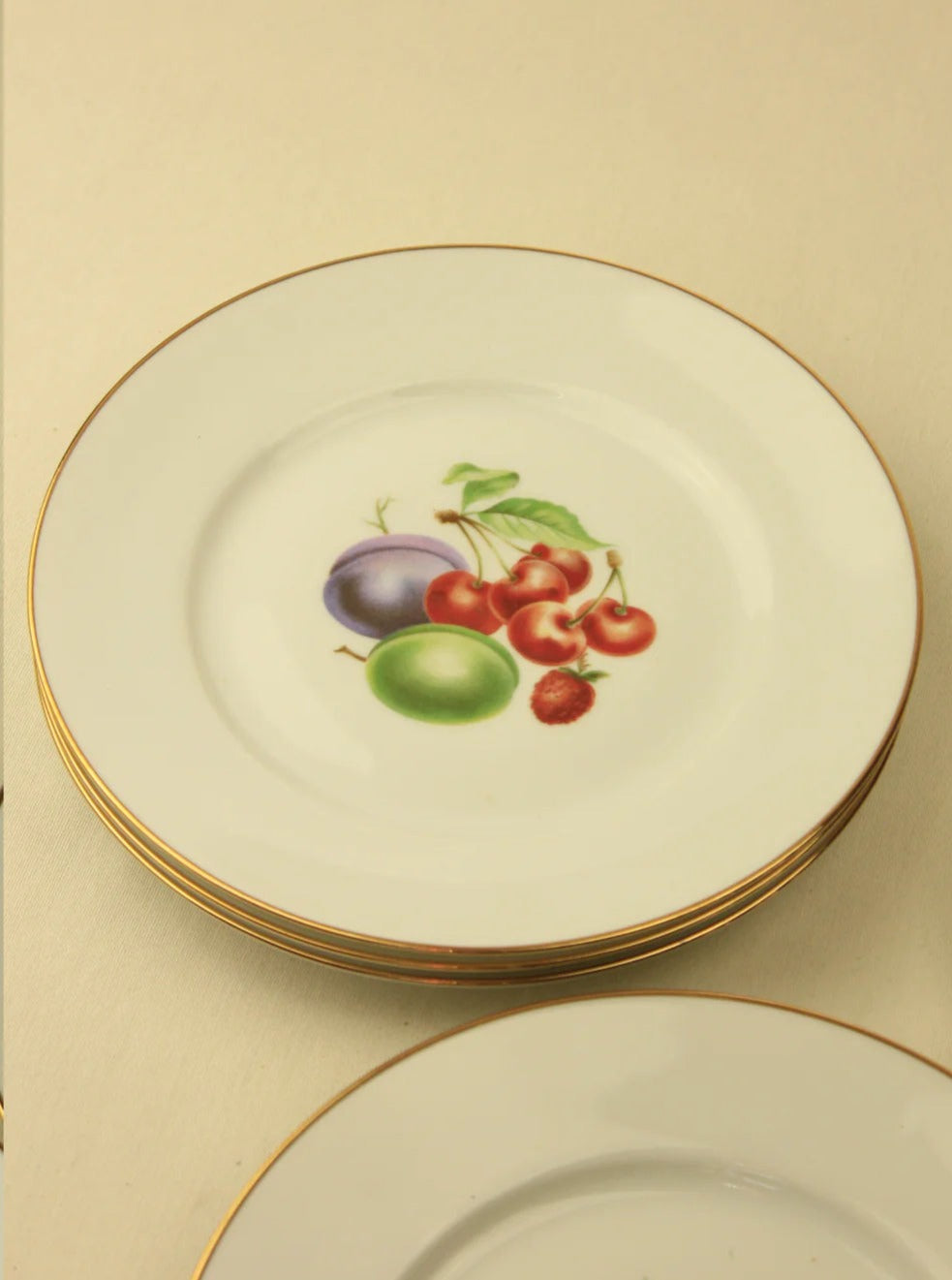 Italian dessert plates adorned with classic Tuscan countryside scenes