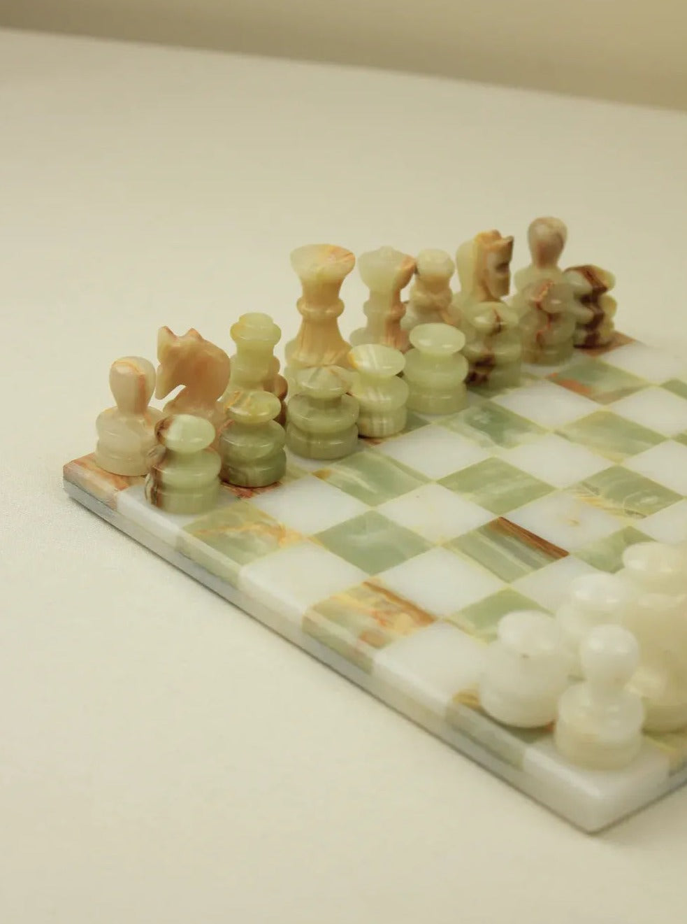 Luxurious onyx chess set featuring a classic design with natural stone textures