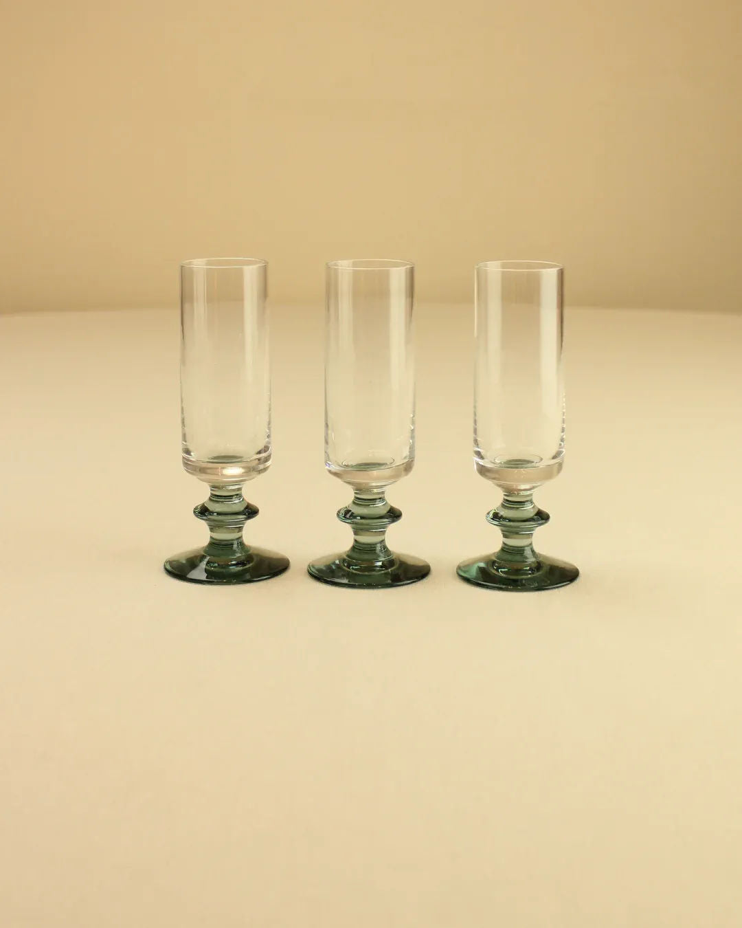 Luxurious liquor cups with intricate floral etching and gold accents