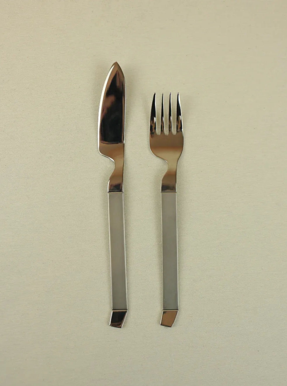 Elegant modernist fish cutlery set with mirror-finish and angular lines
