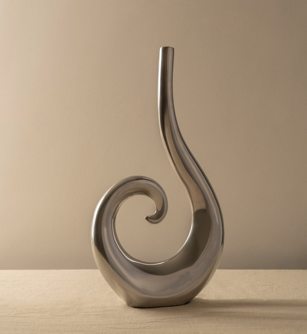Curly Vase with intricate swirled design and vibrant blue color