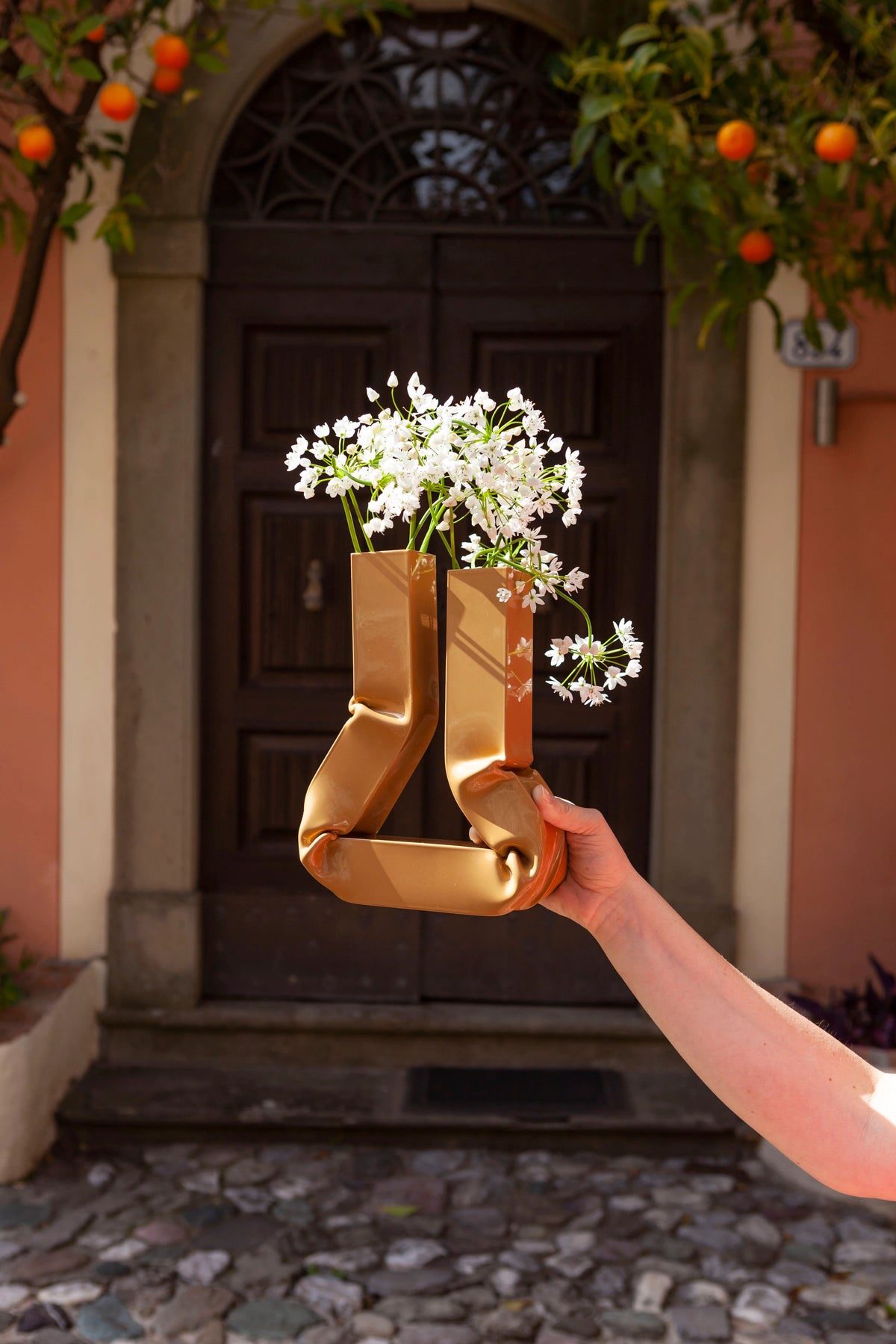 Handcrafted caramel-colored ceramic Vasi Vase with elegant, curvaceous design