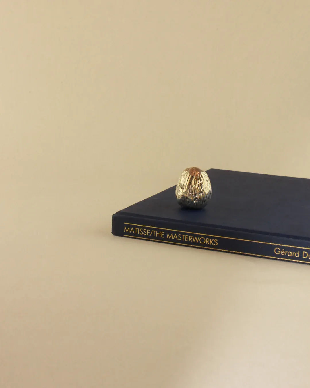 Silver Walnut Sculpture crafted from polished metal, resembling a majestic tree