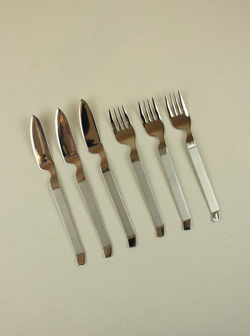 Modernist fish cutlery made of sleek stainless steel with ergonomic handle design