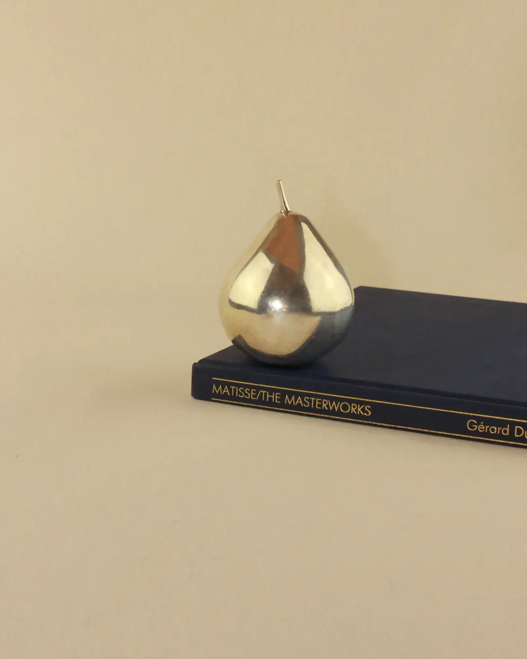 Handcrafted silver pear sculpture, a beautiful and unique home decor accessory