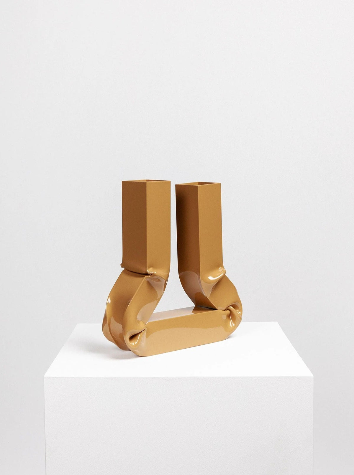 A close-up photo of the Vasi Vase (Caramel) product, showcasing its unique caramel color and elegant design, ideal for adding a touch of warmth and sophistication to any interior space