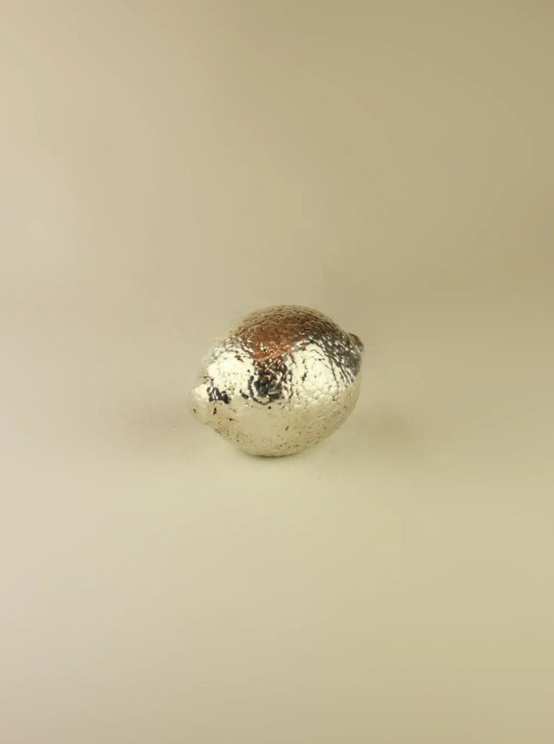 Exquisite silver lime sculpture with intricate details and smooth texture