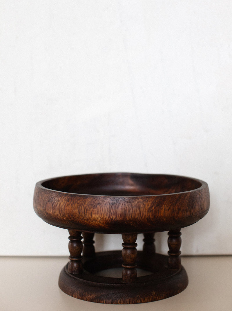 Wooden tray with intricate carved designs and handles for easy carrying