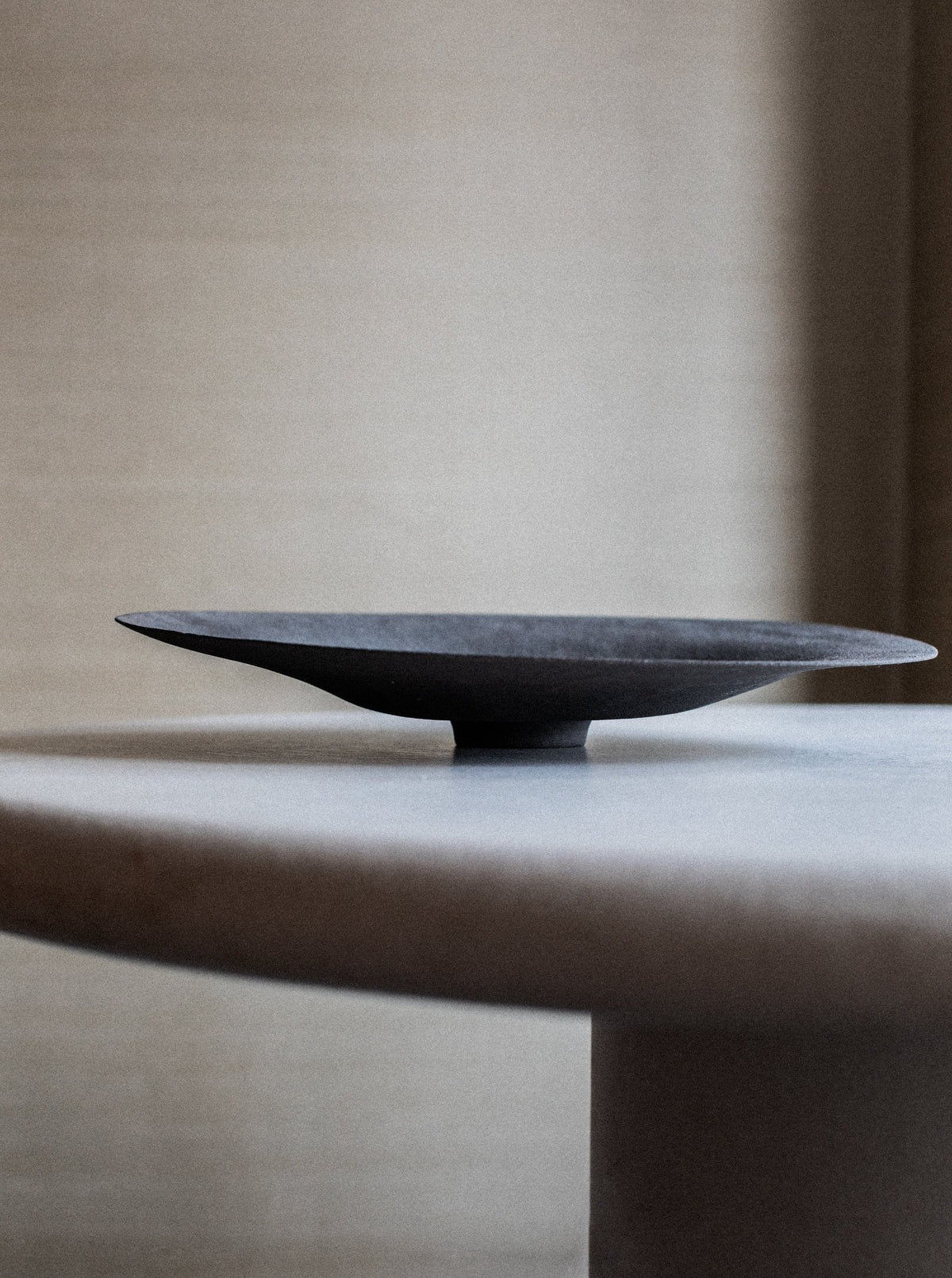 Sculptural Bowl featuring a sleek and modern design crafted from brushed metal