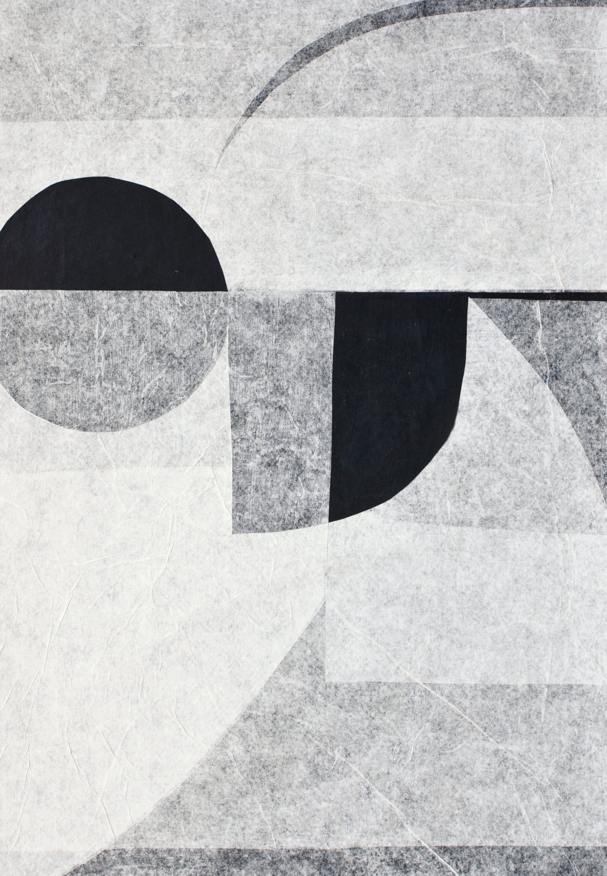 Abstract geometric design with overlapping circles and lines in shades of black, white, and gray on a handmade cotton paper surface by Julita Elbe's Invisible.
