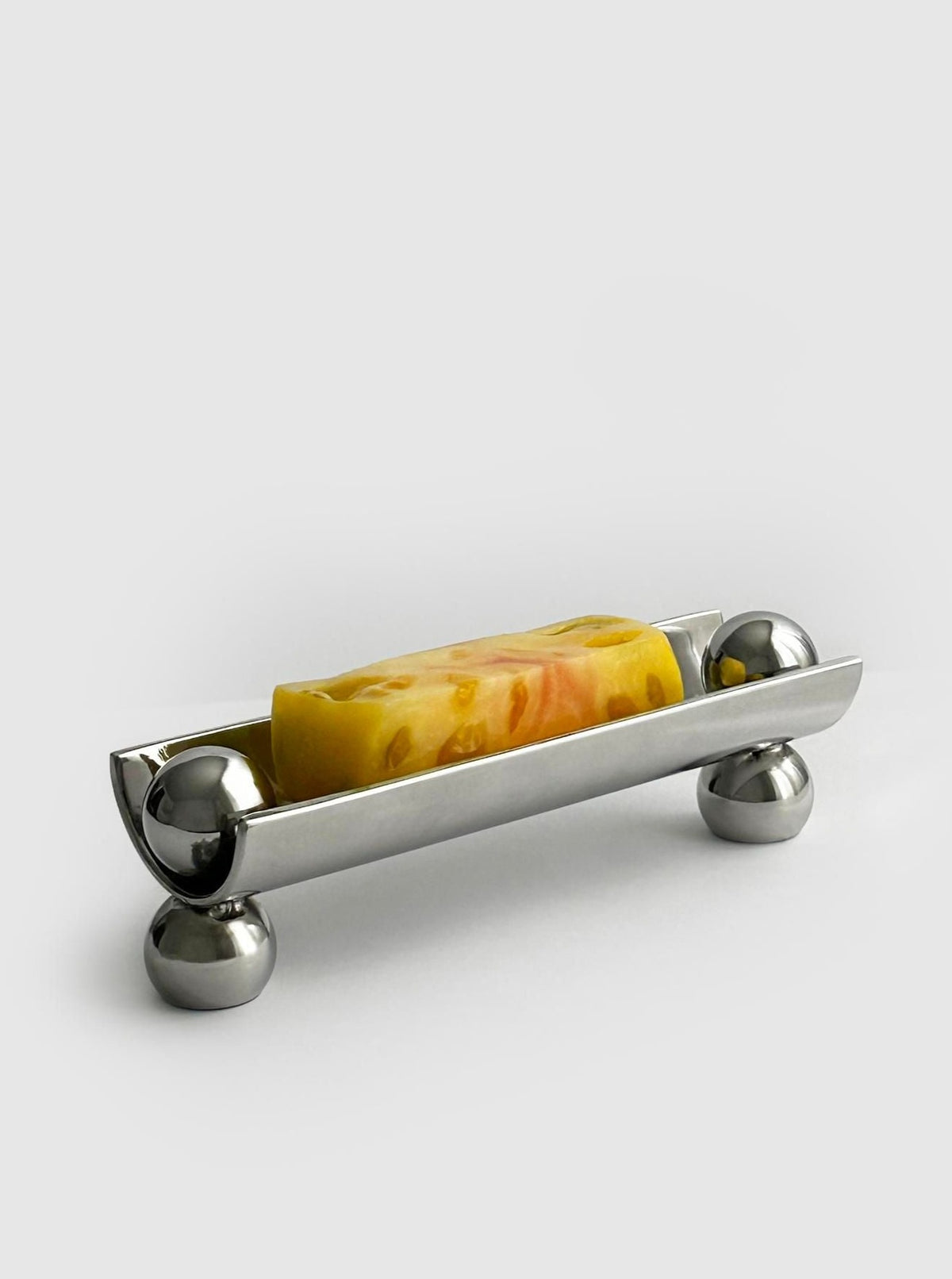 Handcrafted semi tube dish with pearl feet, perfect for serving appetizers