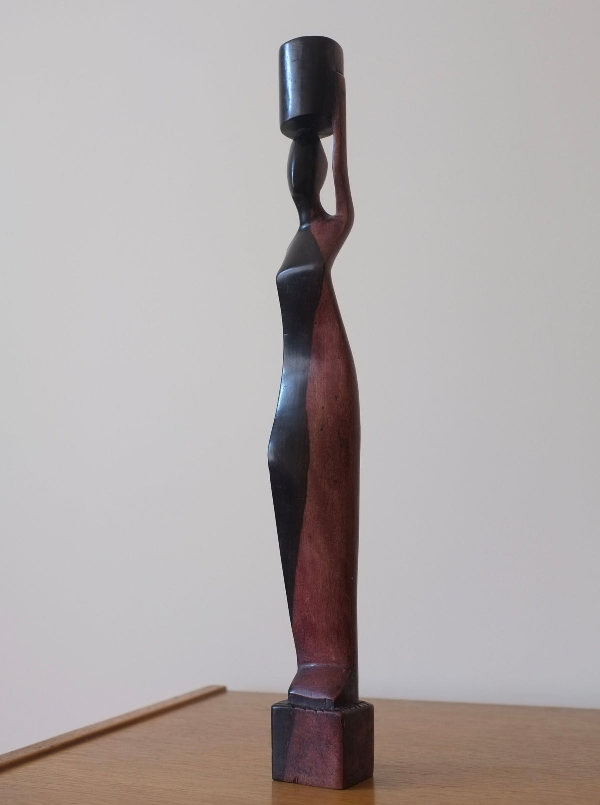 Wooden-candleholder-sculpture-with-intricately-carved-female-form-and-ornate-details