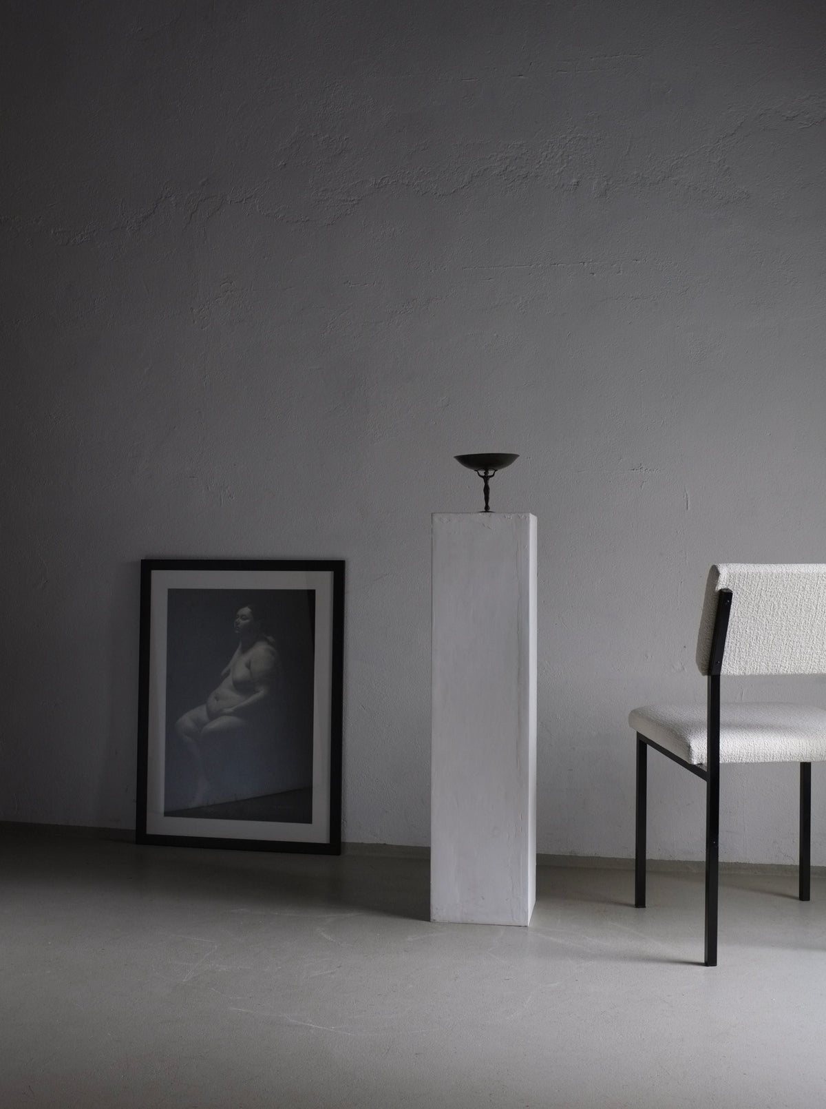 Vintage 1960s white boucle chairs with black metal frames, classic mid-century modern design