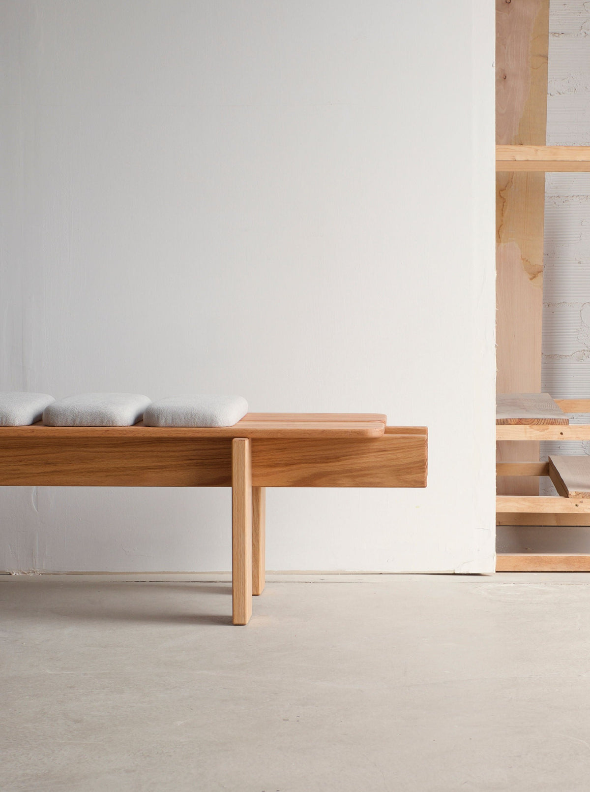  Close-up of Ueno Bench showing sleek design with slatted seat and backrest, ideal for stylish and comfortable outdoor seating