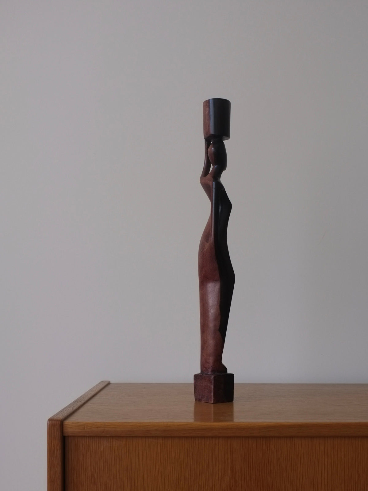 Decorative-wooden-candleholder-hand-carved-to-portray-a-stunning-female-figure