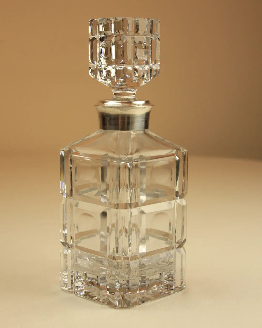 An elegant whiskey decanter featuring an Art Deco style design, perfect for stylishly displaying and serving fine spirits